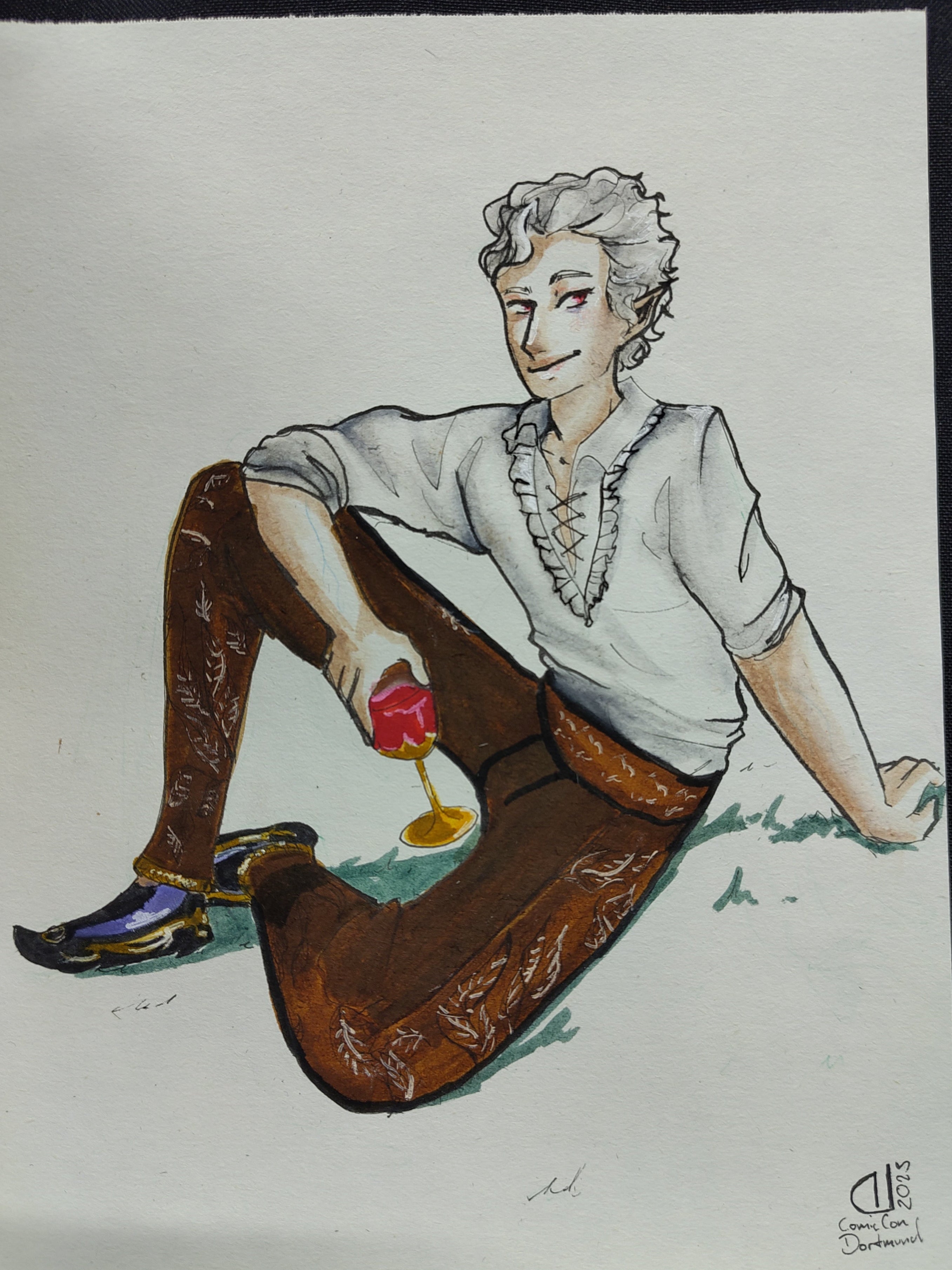 Photo of a commission of Astarion from Baldur's Gate 3, He is sitting on grass, smiling mischeviously and holdind a cup of bloodred wine in his hand.