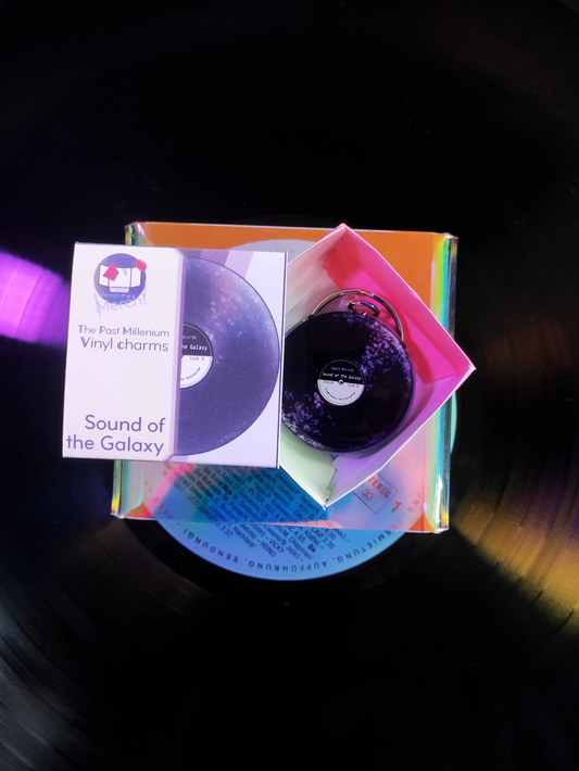 Purple, galaxy themed vinyl on a dark background